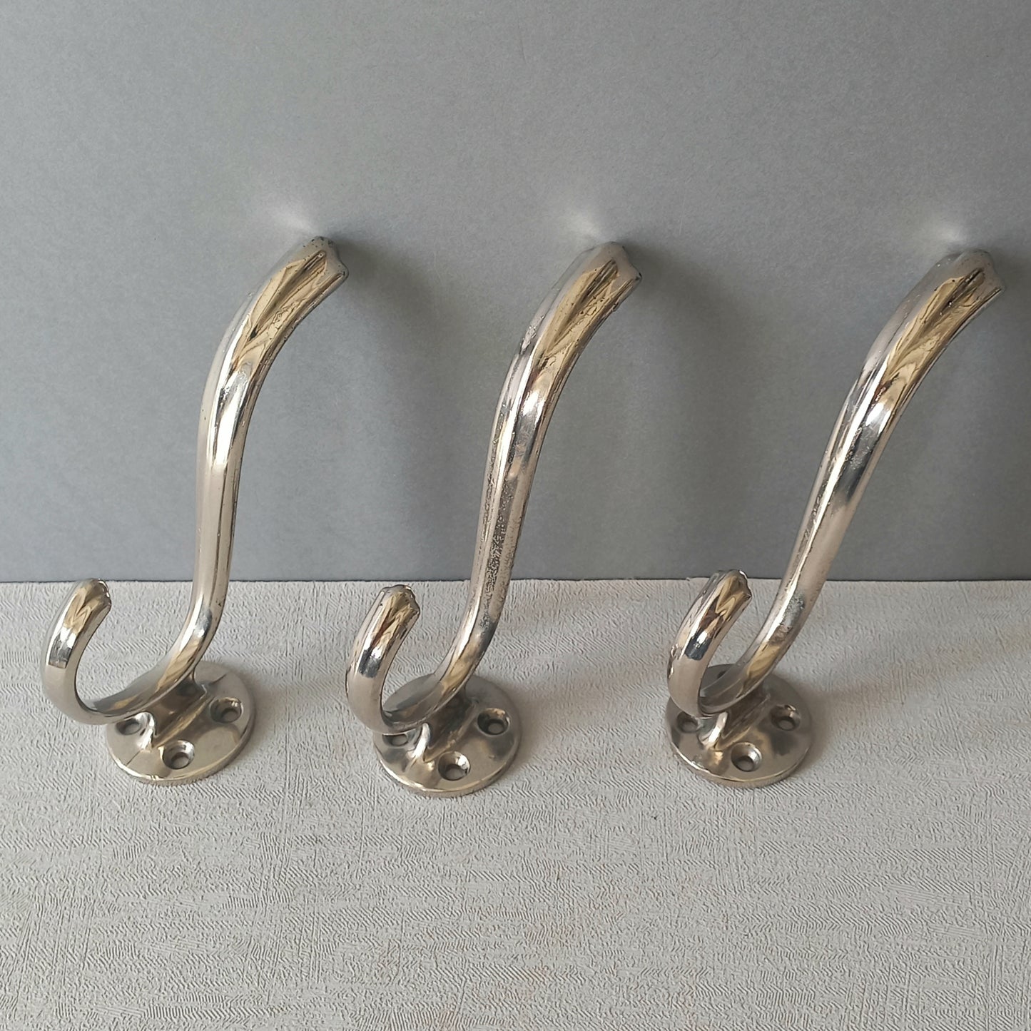3 x French vintage silver coloured metal coat hooks in used sturdy used condition. Good for coat storage, dog leads, or maybe in the kitchen or bathroom for towels.
Circa. 1930s/1950s.