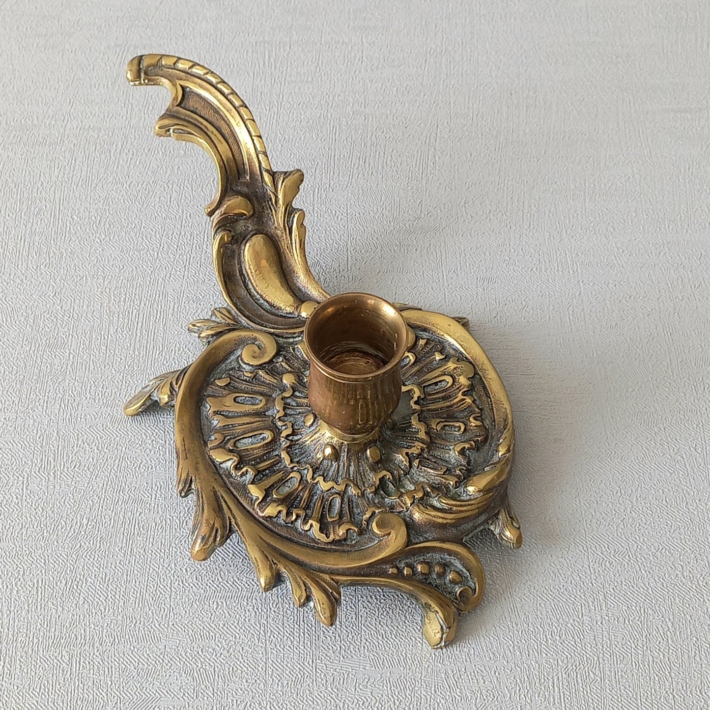 An original French antique brass/bronze chamber stick, a small, heavy for its size and decorative antique candle holder that will be a welcome addition to any interior.