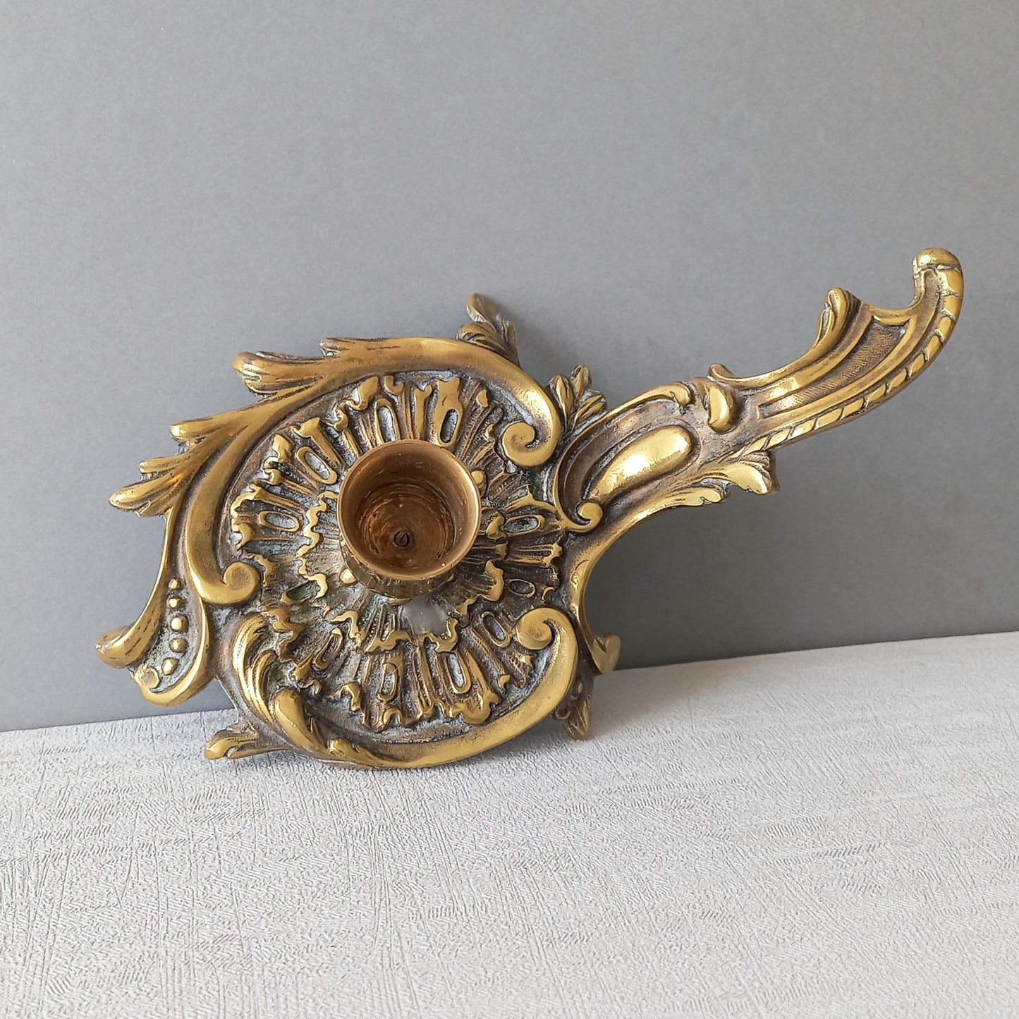An original French antique brass/bronze chamber stick, a small, heavy for its size and decorative antique candle holder that will be a welcome addition to any interior.