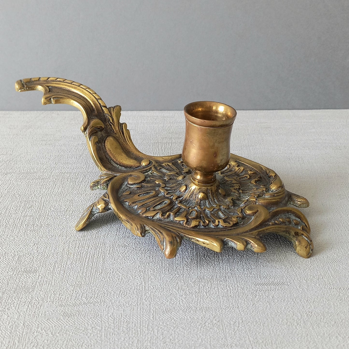 An original French antique brass/bronze chamber stick, a small, heavy for its size and decorative antique candle holder that will be a welcome addition to any interior.