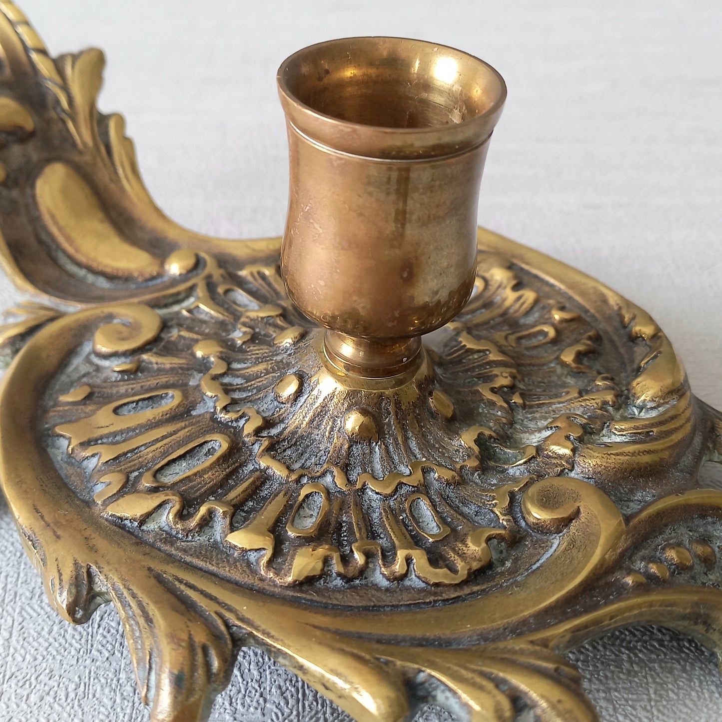 An original French antique brass/bronze chamber stick, a small, heavy for its size and decorative antique candle holder that will be a welcome addition to any interior.