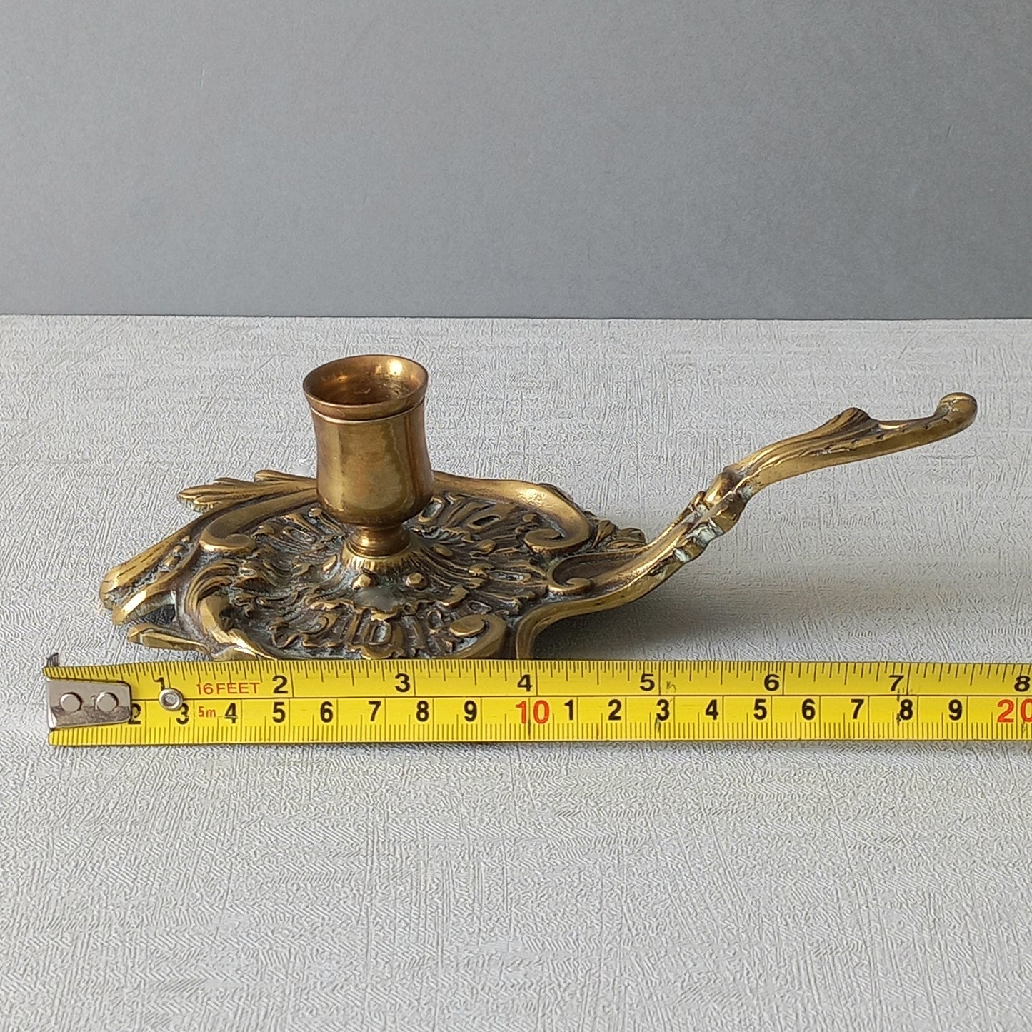 An original French antique brass/bronze chamber stick, a small, heavy for its size and decorative antique candle holder that will be a welcome addition to any interior.