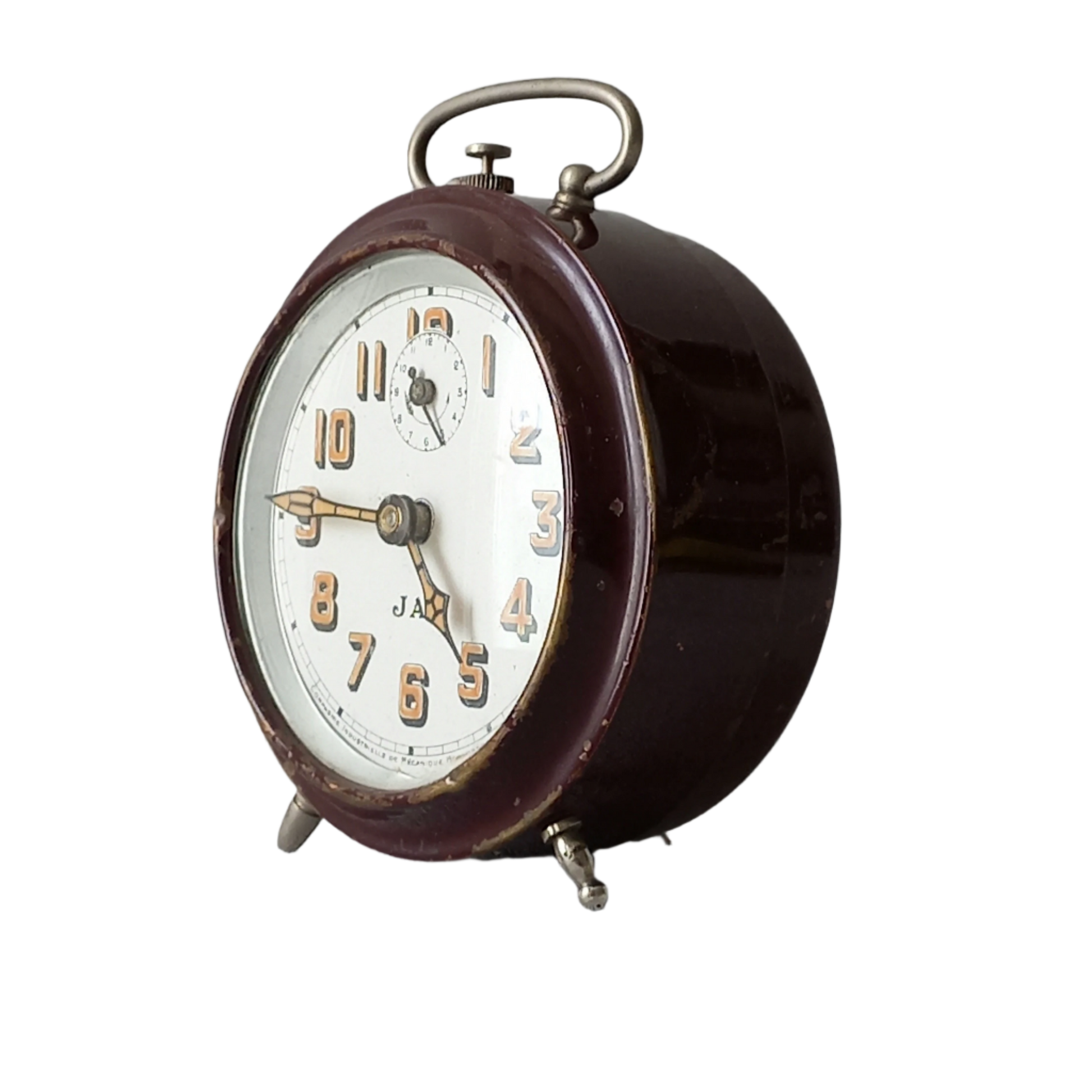 A handsome little vintage alarm clock by premier French manufacturer, Jaz.
This wonderful little clock is in semi-working condition including the alarm, although I should note that being an old time piece dating from the pre-1940 period he's temperamental and sometimes will just stop working, although all that's needed is a gentle shake from side to side and he will once more begin to tick - sometimes you might have to repeat this and have patience with him.