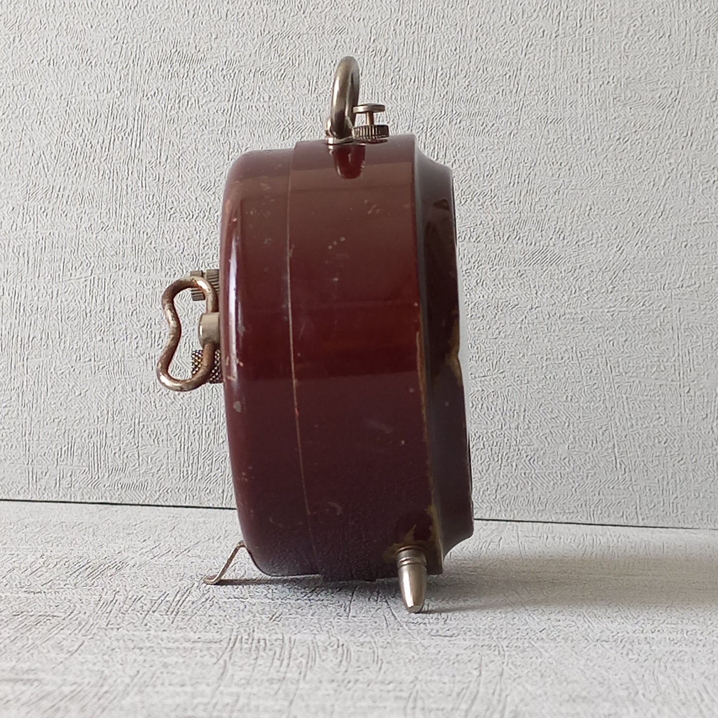 A handsome little vintage alarm clock by premier French manufacturer, Jaz.
This wonderful little clock is in semi-working condition including the alarm, although I should note that being an old time piece dating from the pre-1940 period he's temperamental and sometimes will just stop working, although all that's needed is a gentle shake from side to side and he will once more begin to tick - sometimes you might have to repeat this and have patience with him.