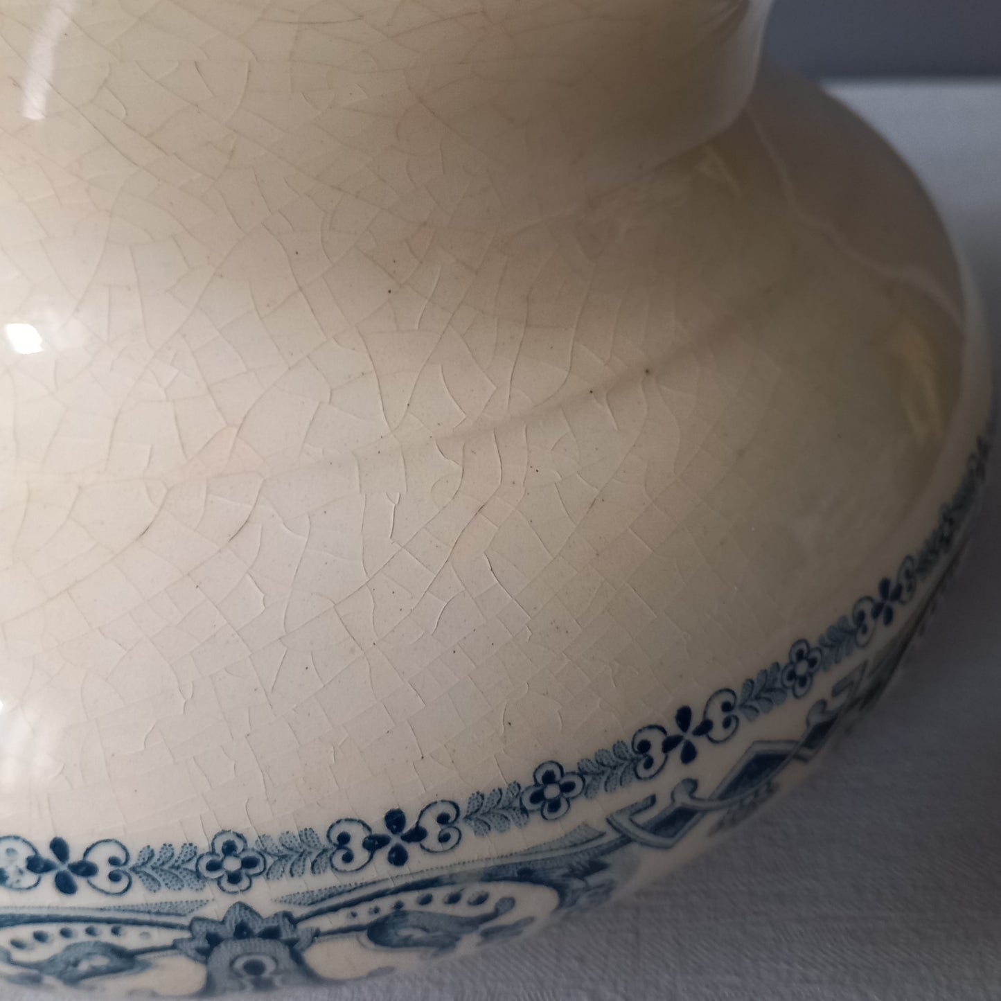 A beautiful French antique jug/pitcher, once used to pour water in a bowl for washing yourself, these days wonderful home decor - many people use them as bathroom decor.
This particular piece is in a lovely shade of off-white/cream with a dark blue transfer pattern - a very stylish and eye-catching piece of ironstone.