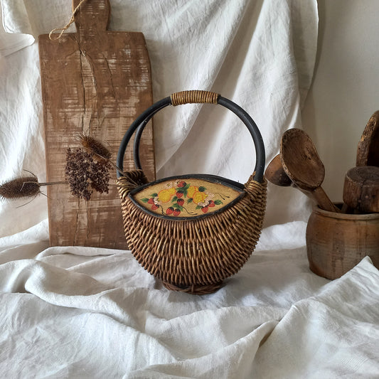 A vintage wicker shopping basket with a small wooden panel on each side with hand-painted fruit - so pretty!
This hand-made piece is full of rustic charm and offers many decorative possibilities to any interior, particularly those of a country, rustic or farmhouse nature.