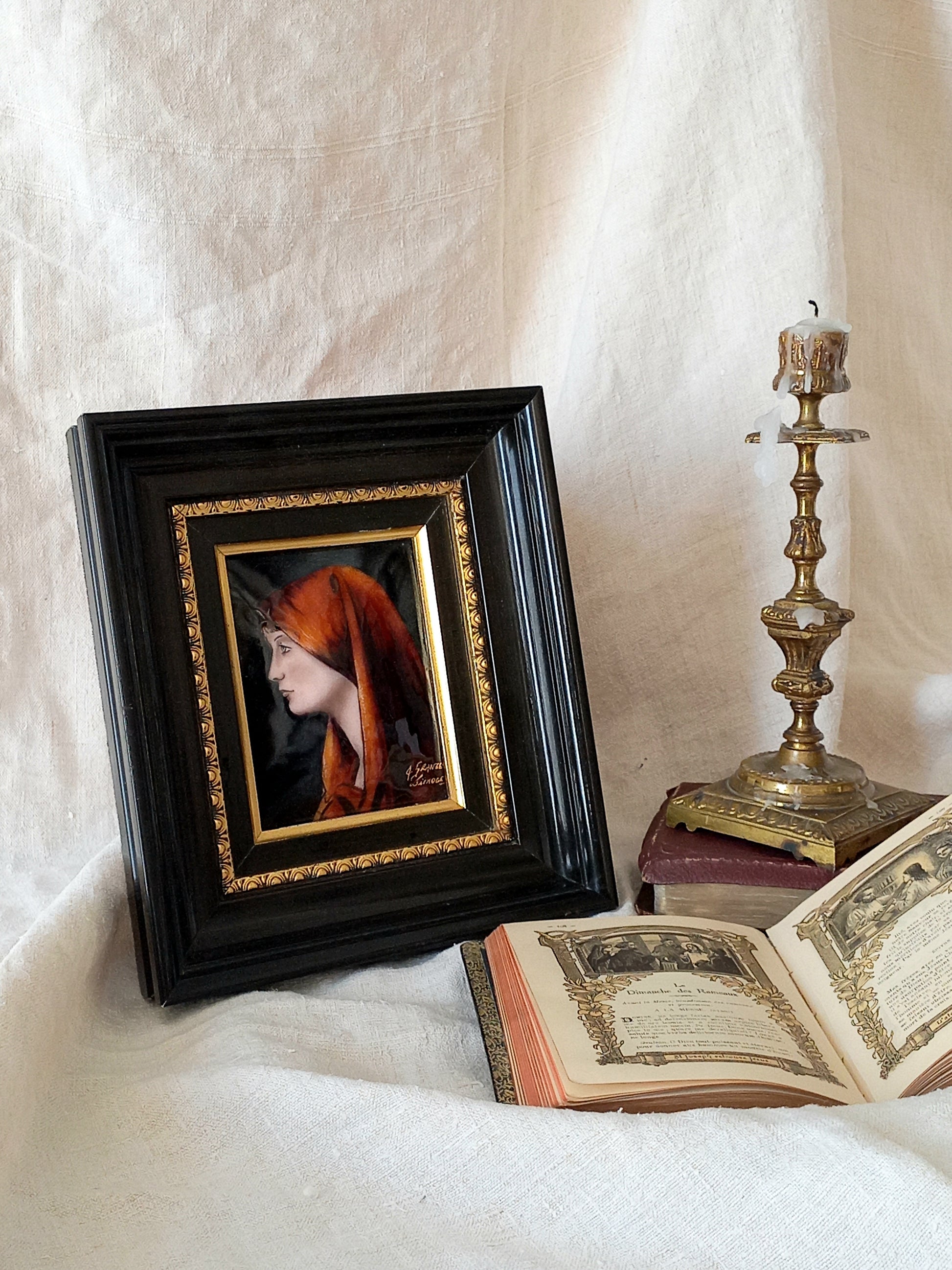 A French vintage religious enamel Saint Fabiola portrait painting by Limoges of France. The religious figure has been hand-painted in enamels on copper and signed by the artist. The art is presented in a dark brown frame with a label to the rear that tells us it's a genuine hand-made enamel artwork.