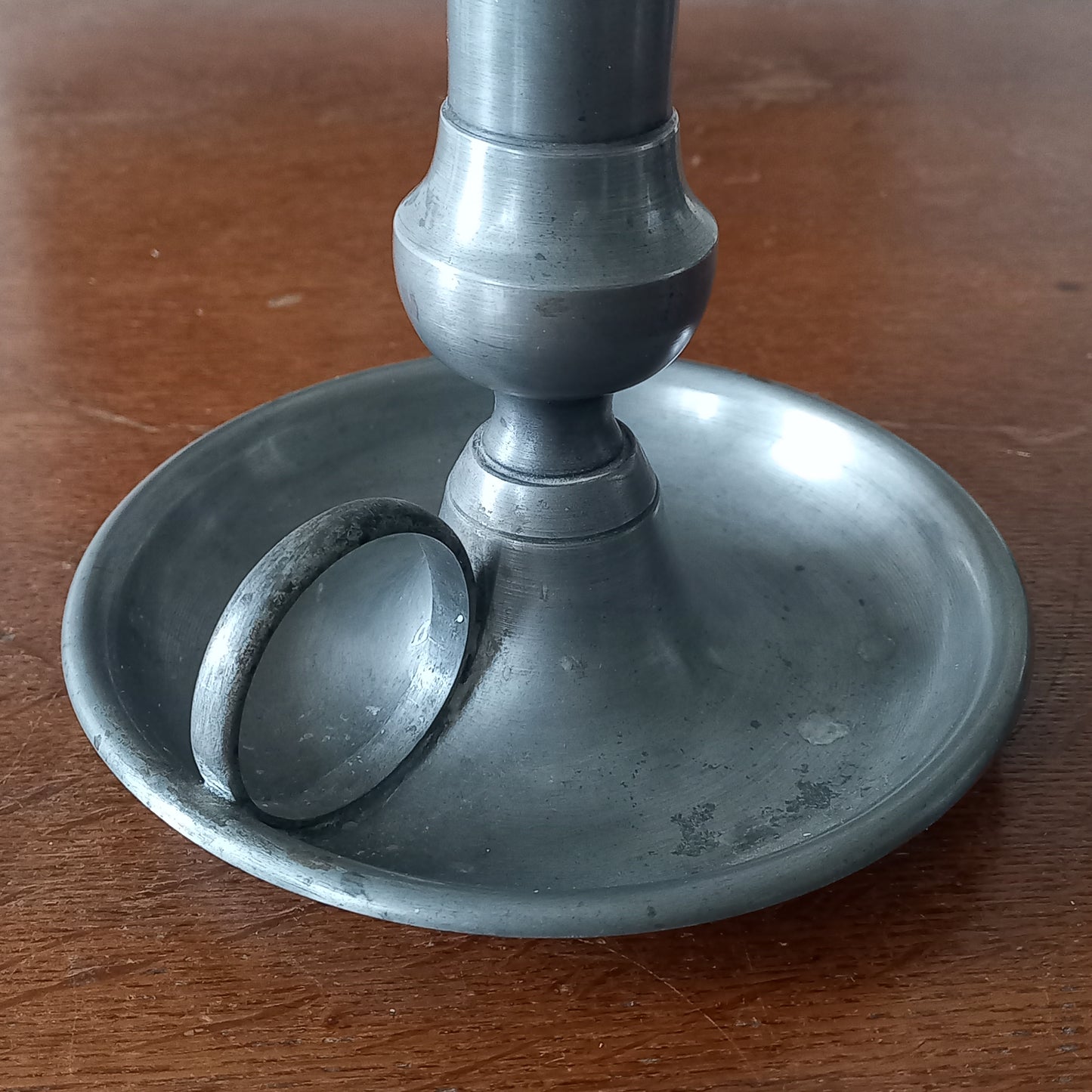 A handsome French vintage pewter candle holder / chamber stick that makes excellent home decor. This chamber stick is taller than similar ones we usually find. Underneath is marked with the manufacturer's stamp - a great looking piece!