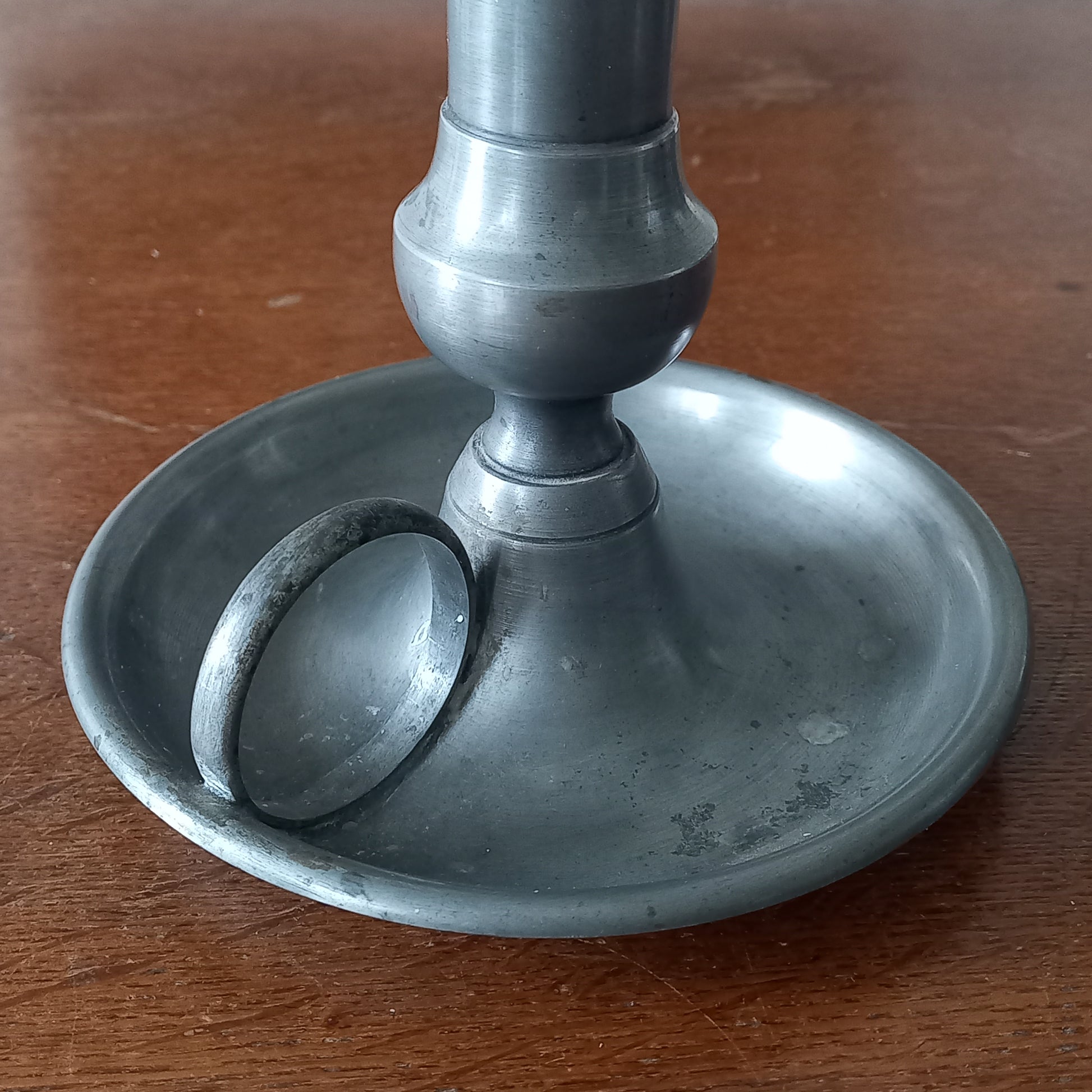A handsome French vintage pewter candle holder / chamber stick that makes excellent home decor. This chamber stick is taller than similar ones we usually find. Underneath is marked with the manufacturer's stamp - a great looking piece!