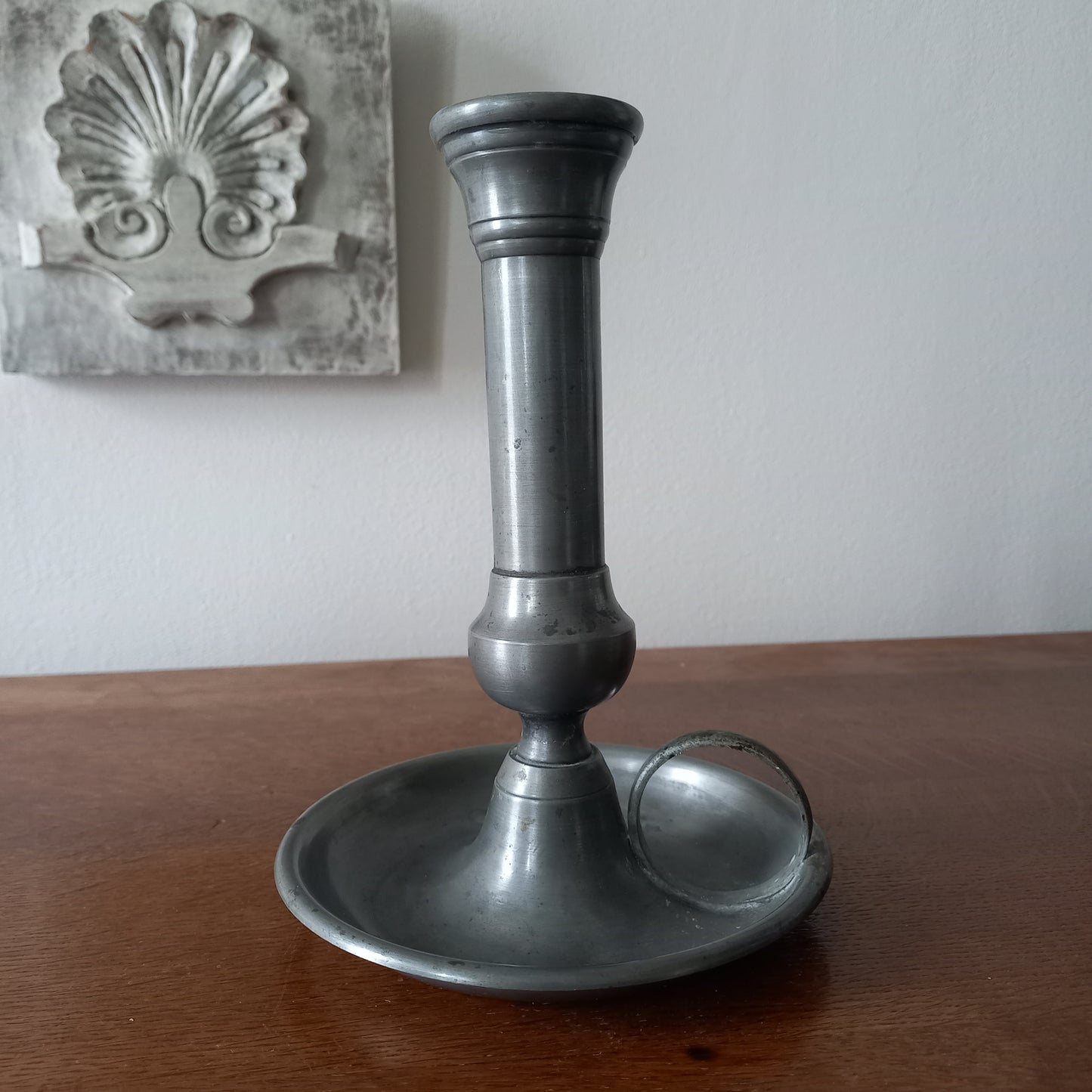 A handsome French vintage pewter candle holder / chamber stick that makes excellent home decor. This chamber stick is taller than similar ones we usually find. Underneath is marked with the manufacturer's stamp - a great looking piece!