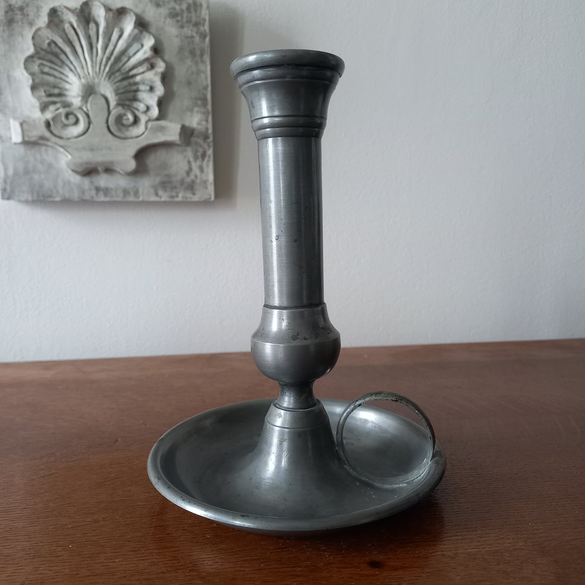 A handsome French vintage pewter candle holder / chamber stick that makes excellent home decor. This chamber stick is taller than similar ones we usually find. Underneath is marked with the manufacturer's stamp - a great looking piece!