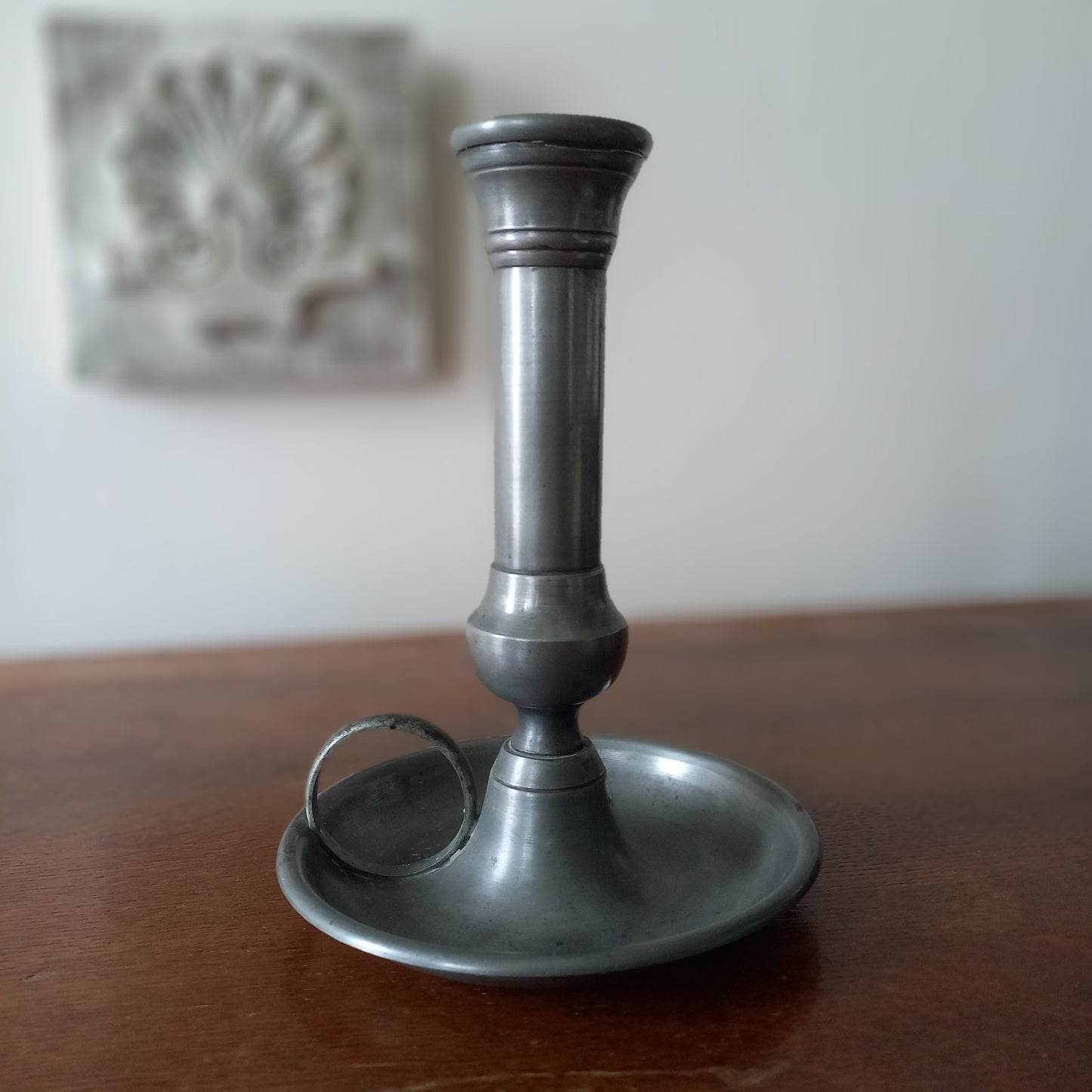 A handsome French vintage pewter candle holder / chamber stick that makes excellent home decor. This chamber stick is taller than similar ones we usually find. Underneath is marked with the manufacturer's stamp - a great looking piece!