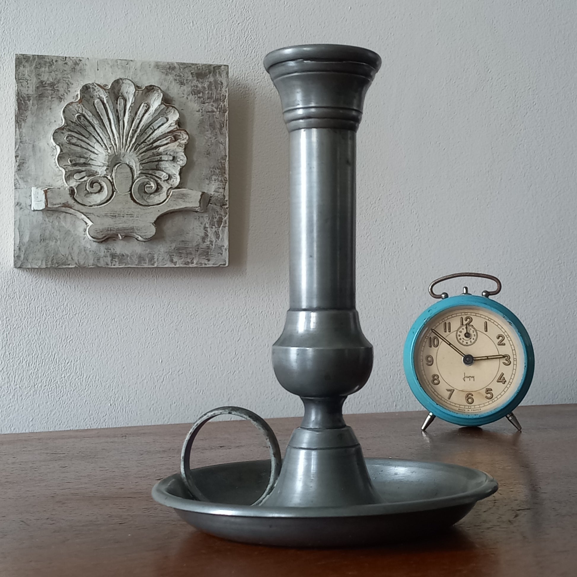 A handsome French vintage pewter candle holder / chamber stick that makes excellent home decor. This chamber stick is taller than similar ones we usually find. Underneath is marked with the manufacturer's stamp - a great looking piece!