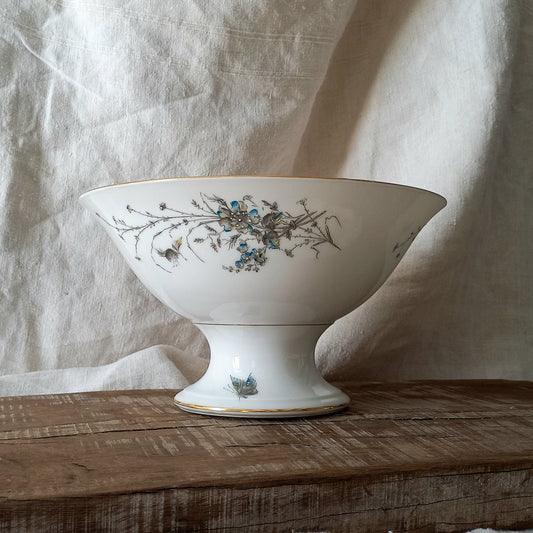 Stunning vintage porcelain compote purchased in south west France.
This beautiful piece is a quality 'footed' fruit bowl with a good weight and absolutely gorgeous floral and butterfly decoration with hand-painted details in relief.