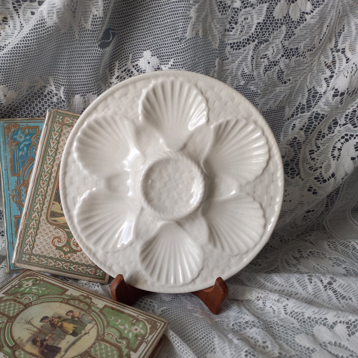 Decorative vintage oyster plate in creamy white colour, French seafood plate