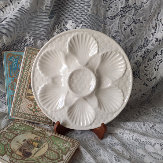 Decorative vintage oyster plate in creamy white colour, French seafood plate