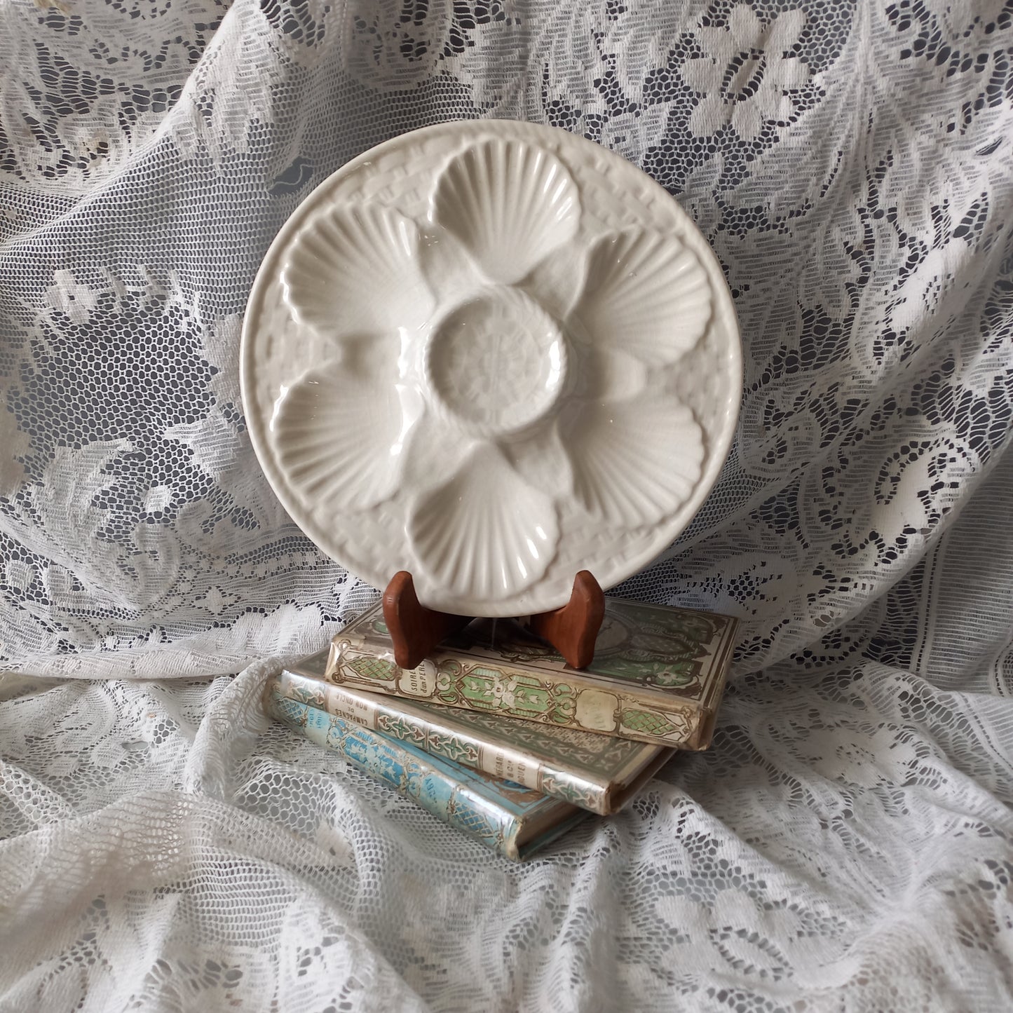 Decorative vintage oyster plate in creamy white colour, French seafood plate