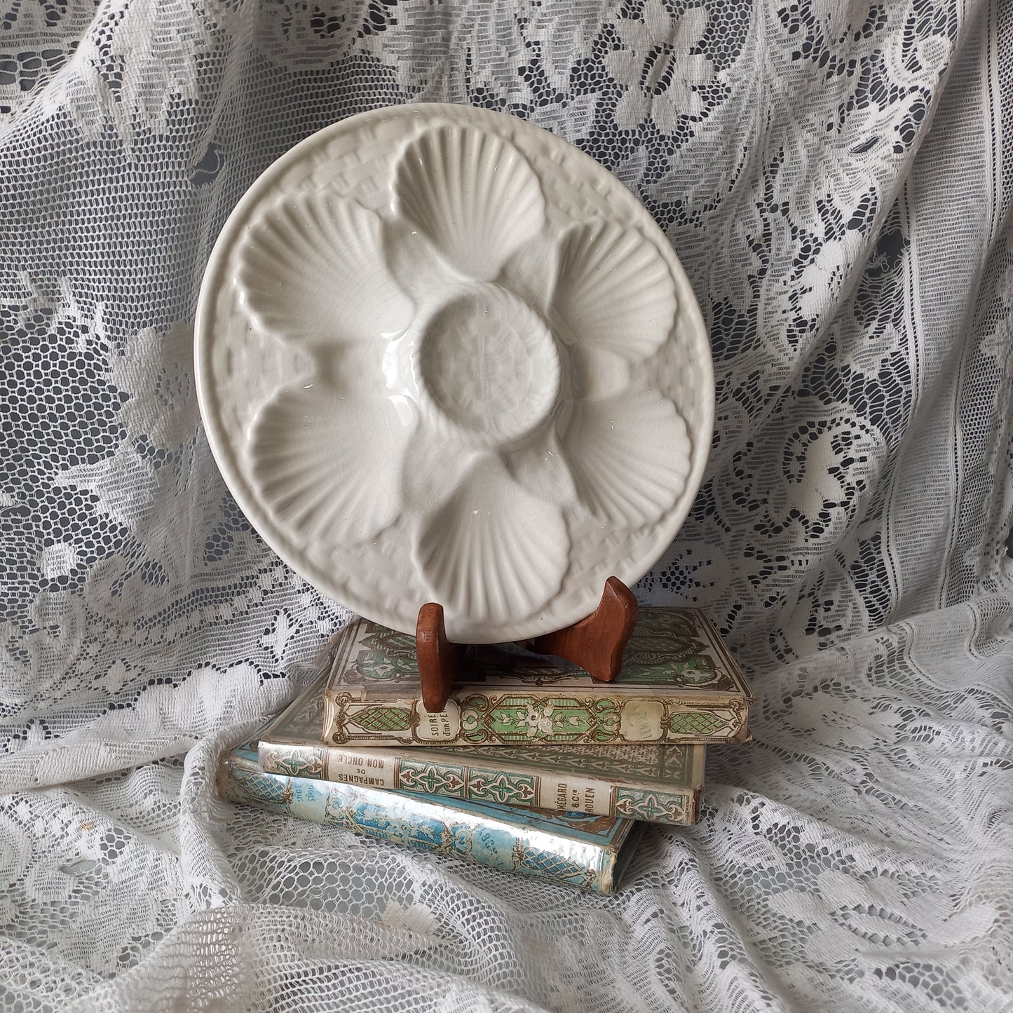 Decorative vintage oyster plate in creamy white colour, French seafood plate