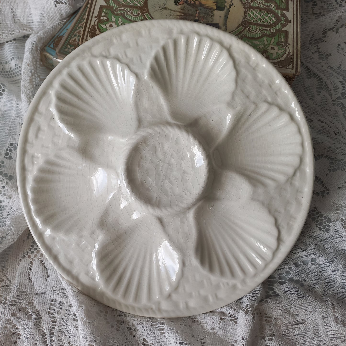 Decorative vintage oyster plate in creamy white colour, French seafood plate