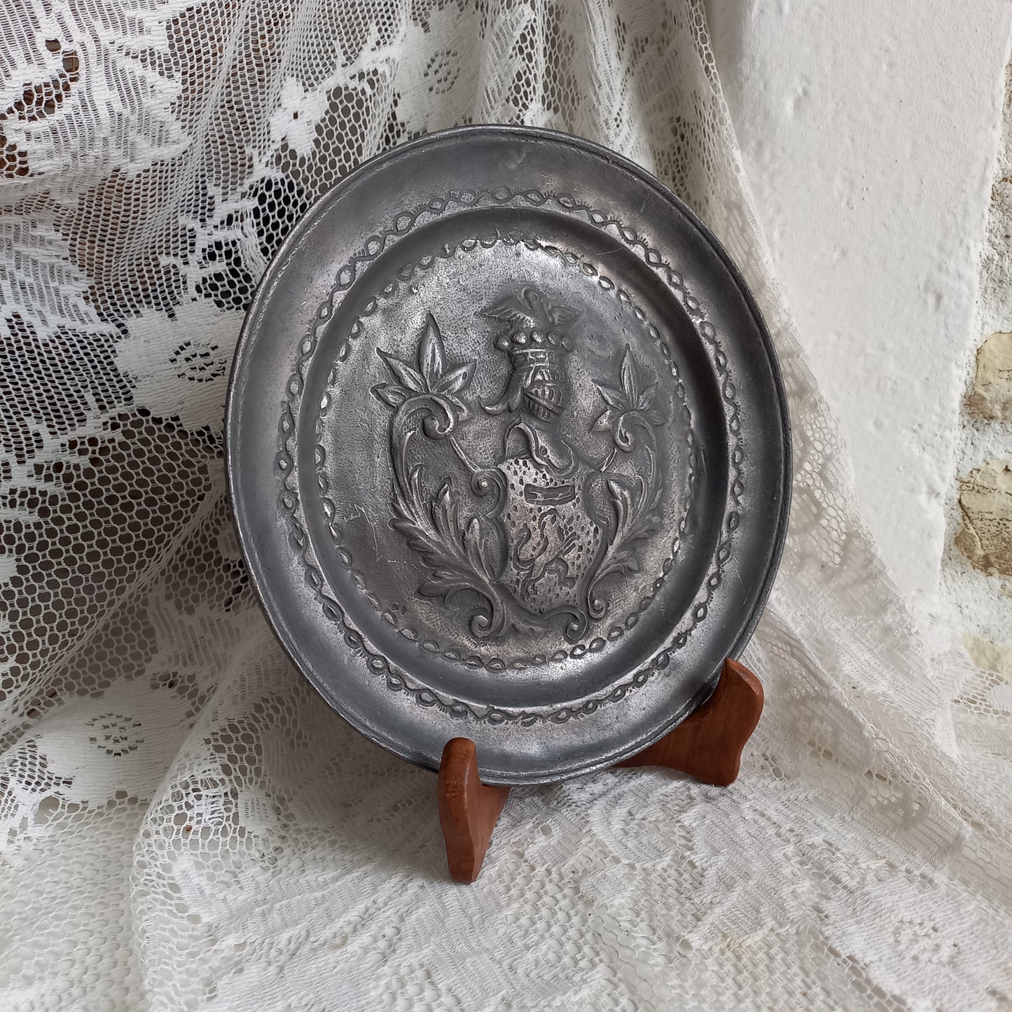 Decorative pewter plate with embossed coat of arms from France