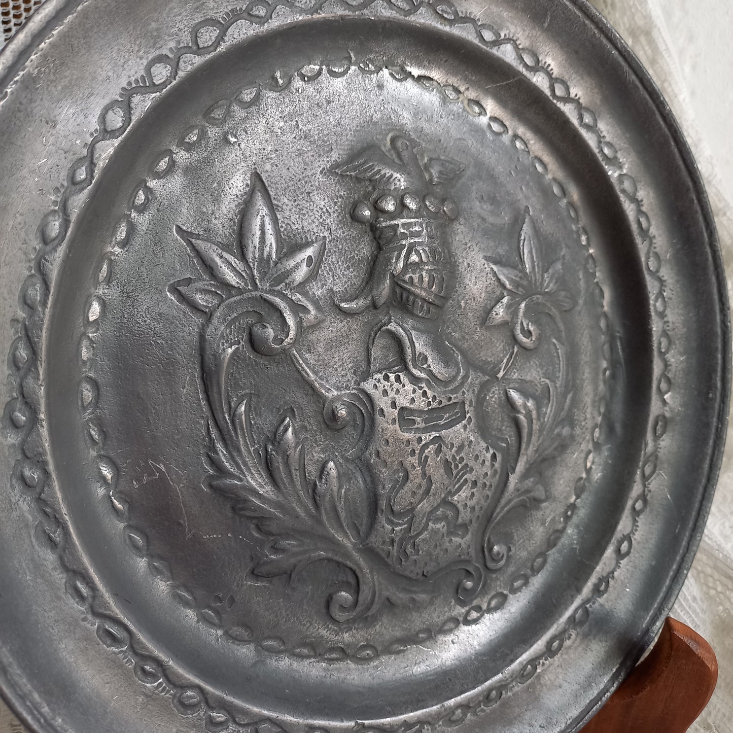 Decorative pewter plate with embossed coat of arms from France