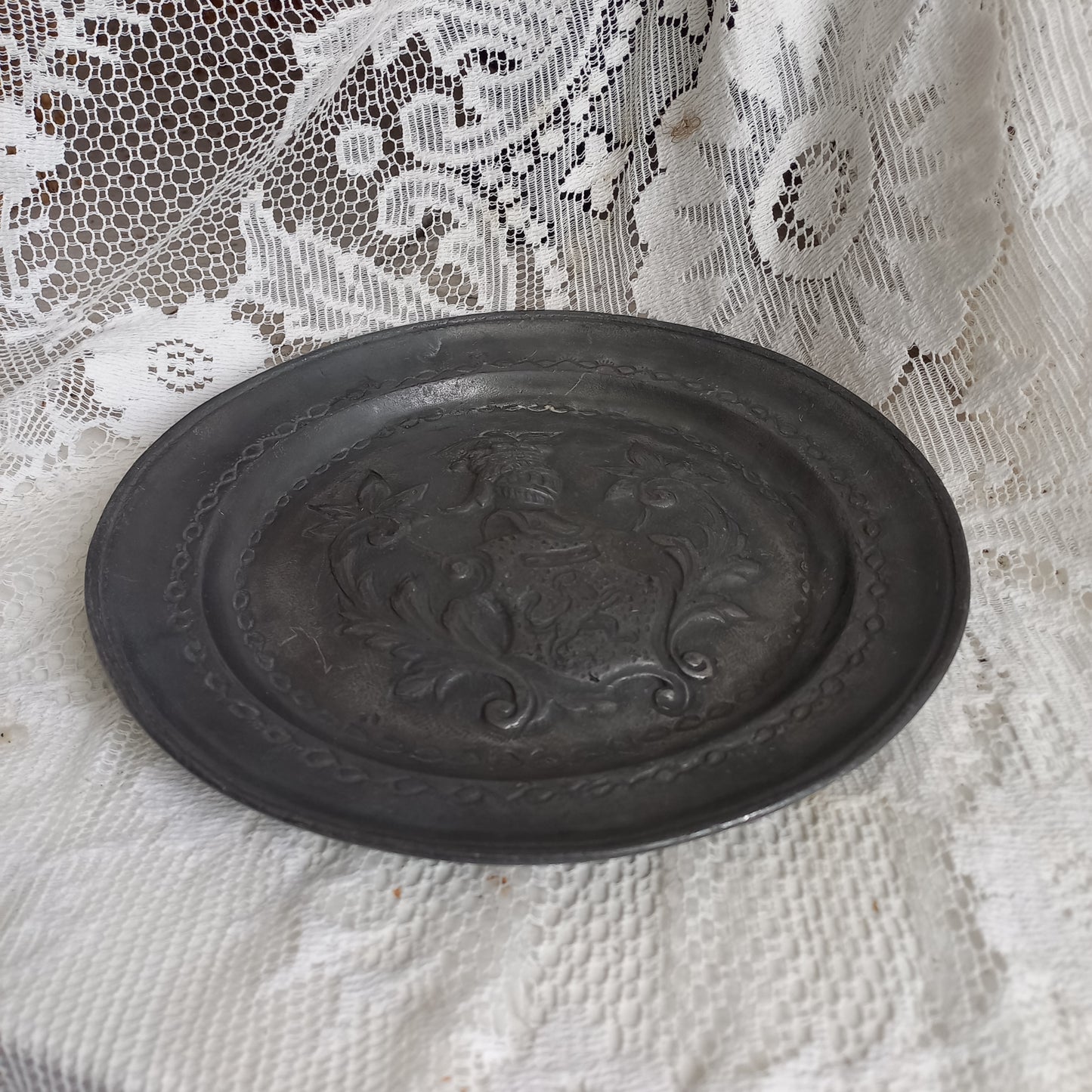 Decorative pewter plate with embossed coat of arms from France