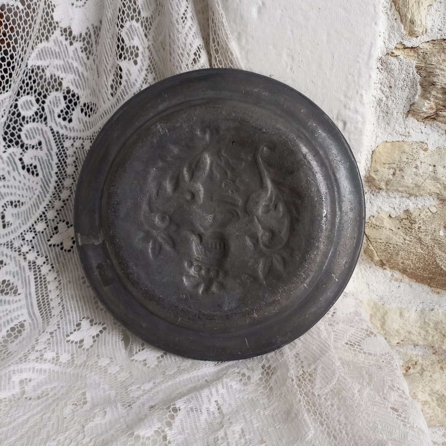 Decorative pewter plate with embossed coat of arms from France