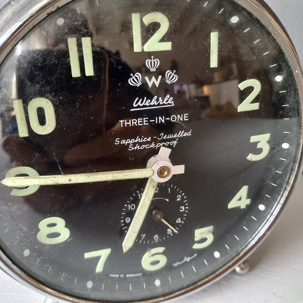 A large vintage mechanical alarm clock by German manufacturer Wehrle, a quality and heavy time-piece. A rare three-in-one clock in working condition including the chiming alarm - it can also sound on the hour and half hour. Gives a pleasing ticking sound and as you can see in the 4th photo, illuminates for a short time after lights out. The overall condition of the clock is used with obvious signs of age-related wear and rusty patina. Circa. 1960s/70s.