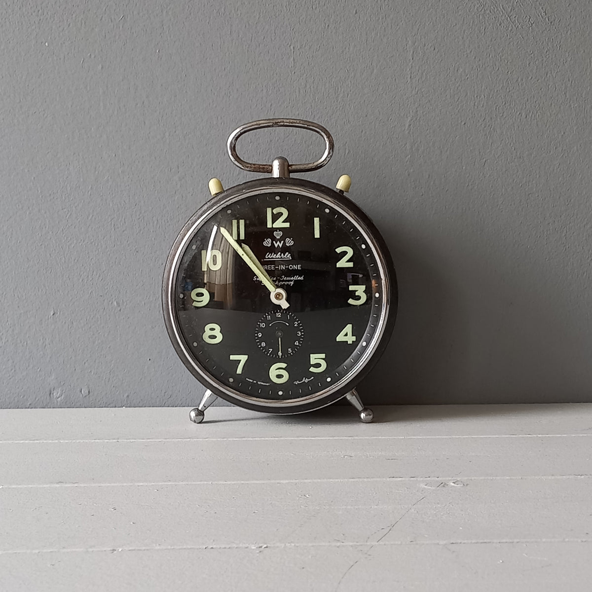 A large vintage mechanical alarm clock by German manufacturer Wehrle, a quality and heavy time-piece. A rare three-in-one clock in working condition including the chiming alarm - it can also sound on the hour and half hour. Gives a pleasing ticking sound and as you can see in the 4th photo, illuminates for a short time after lights out. The overall condition of the clock is used with obvious signs of age-related wear and rusty patina. Circa. 1960s/70s.