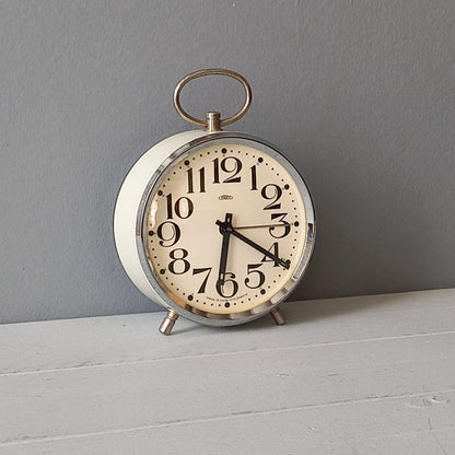 white vintage alarm clock, retro mechanical clock, bedside or nightstand ticking clock