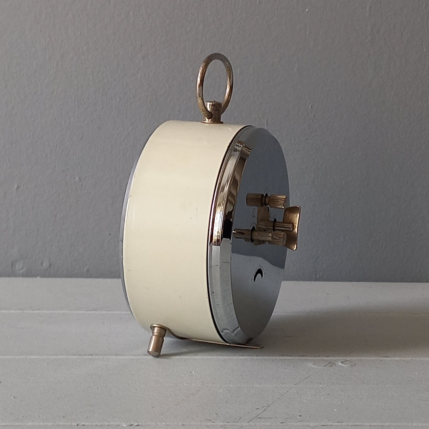 white vintage alarm clock, retro mechanical clock, bedside or nightstand ticking clock