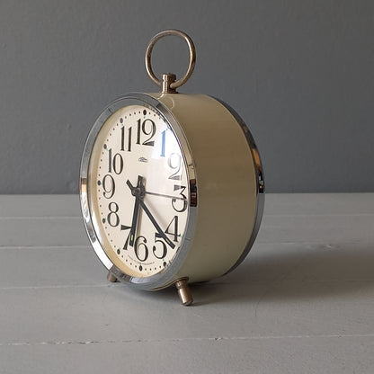 white vintage alarm clock, retro mechanical clock, bedside or nightstand ticking clock