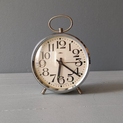 white vintage alarm clock, retro mechanical clock, bedside or nightstand ticking clock