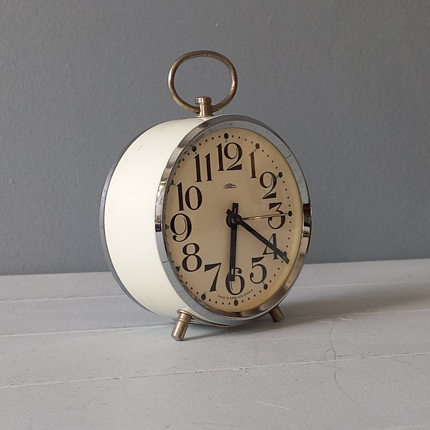 white vintage alarm clock, retro mechanical clock, bedside or nightstand ticking clock