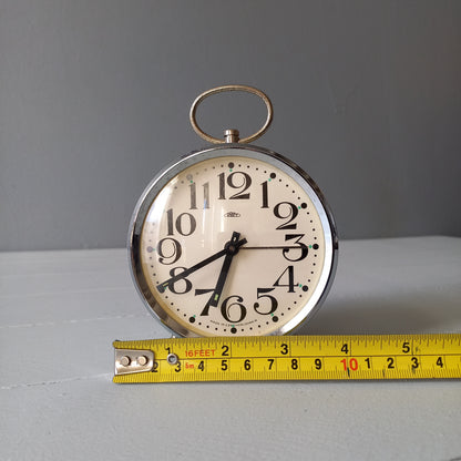 white vintage alarm clock, retro mechanical clock, bedside or nightstand ticking clock