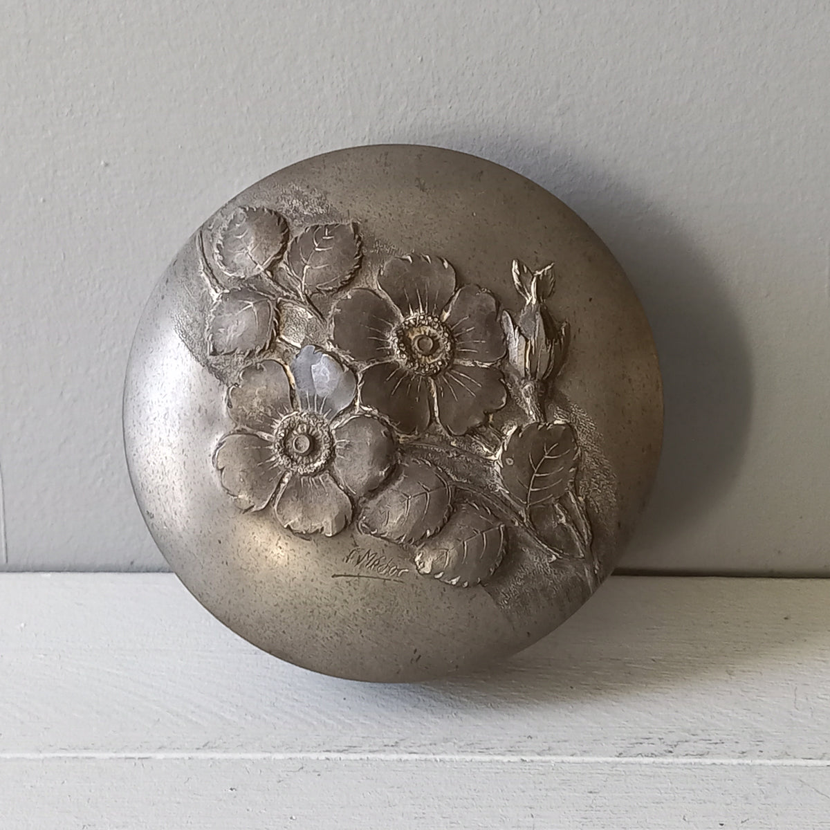 A stylish French vintage/antique decorative pewter lidded pot signed F. Medoc. The lid is adorned with flowers in relief while around the circumference is a simple yet stylish design. A great piece of French pewter indeed.