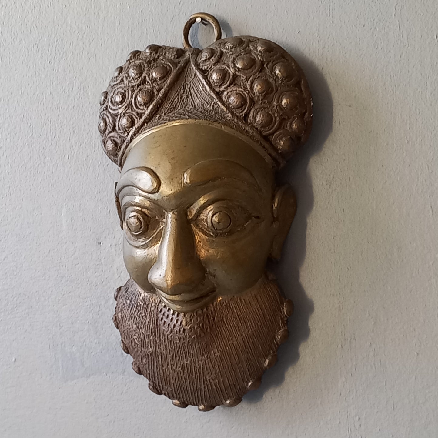 Decorative vintage metal tribal mask, Ethnic bearded man's face decorative wall art