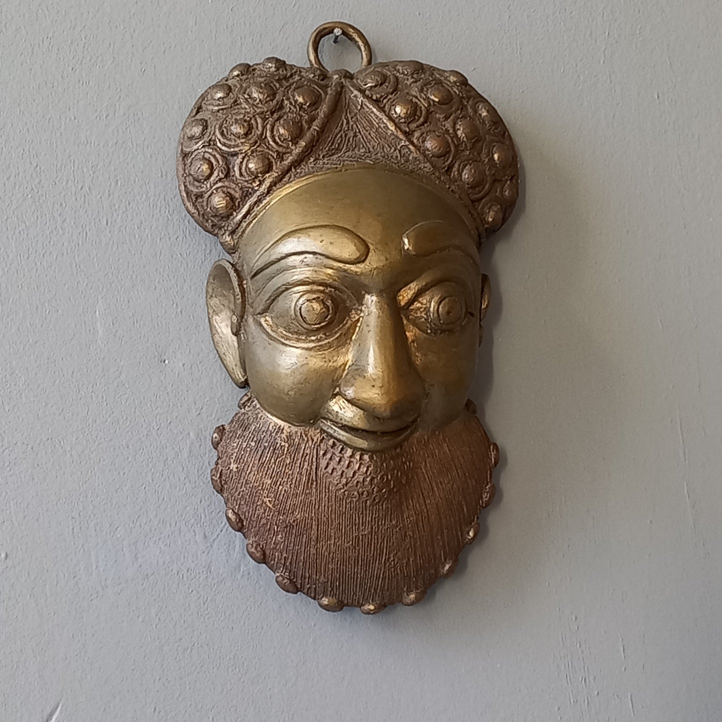 Decorative vintage metal tribal mask, Ethnic bearded man's face decorative wall art