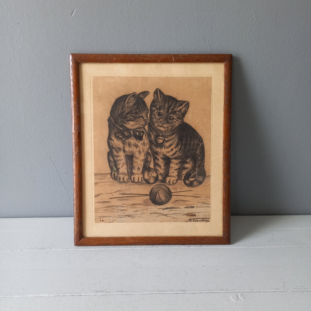 A French vintage drawing of two cute cats or kittens who look like they're planning to be naughty with their owner's ball of wool, a naive piece of art although none-the-less very charming indeed. It appears to be an original drawing, although I haven't opened up the back as it's well sealed with the original French framer's label. The drawing has been signed by the artist.