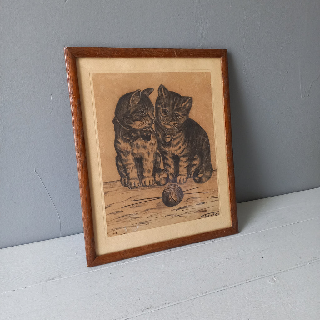 A French vintage drawing of two cute cats or kittens who look like they're planning to be naughty with their owner's ball of wool, a naive piece of art although none-the-less very charming indeed. It appears to be an original drawing, although I haven't opened up the back as it's well sealed with the original French framer's label. The drawing has been signed by the artist.