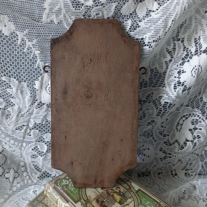 Wall-mounted vintage/antique religious wall decor with metal crucifix and religious figures, and a glass Holy Water font mounted to a wooden base. A great piece of original religious decor from France.