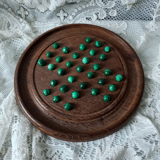 Handmade wooden solitaire board with semi-precious malachite marbles, decorative vintage board game