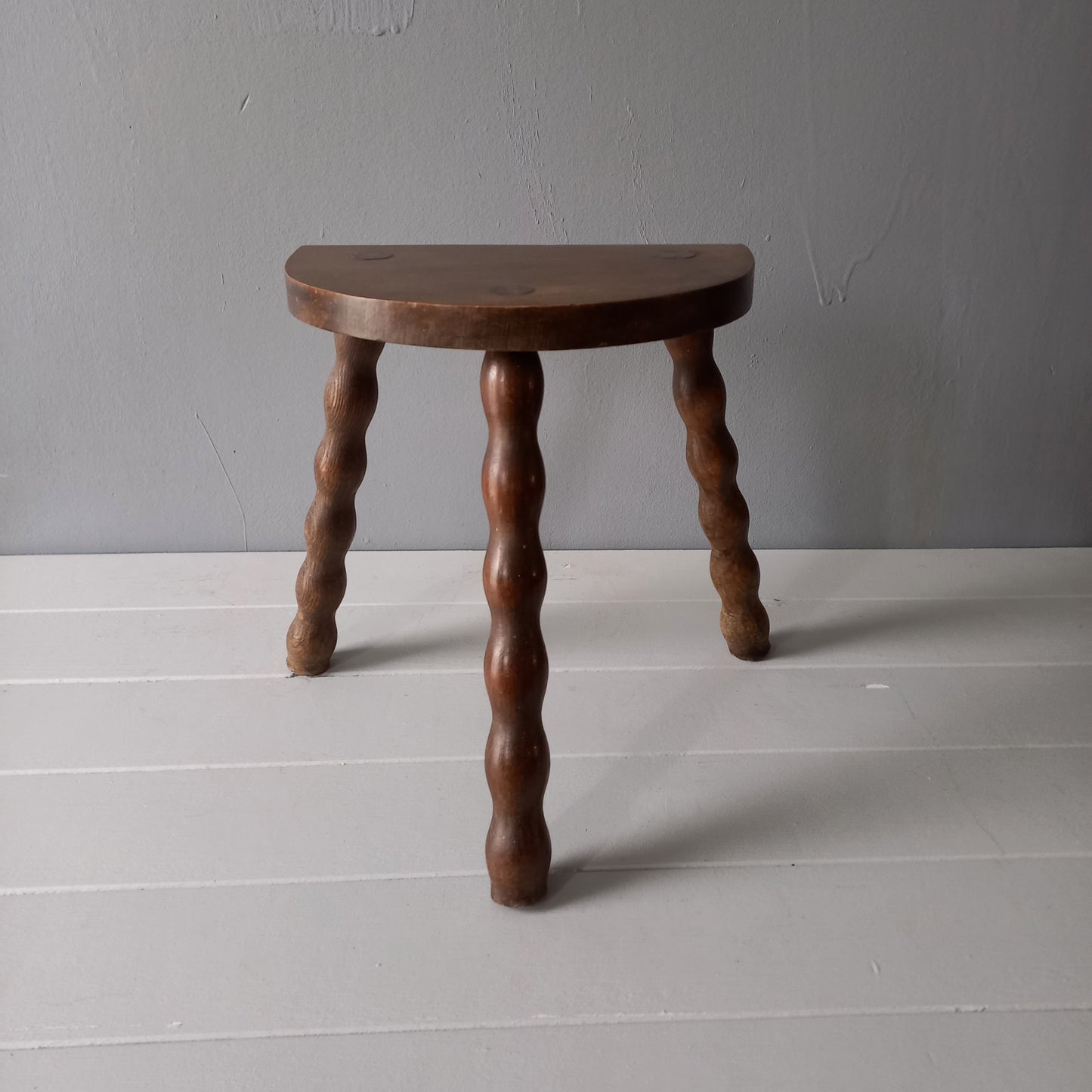 Vintage wooden stool with three turned wooden legs, rustic farmhouse decor, plant stand