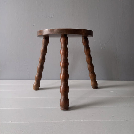 Vintage wooden stool with three turned wooden legs, rustic farmhouse decor, plant stand