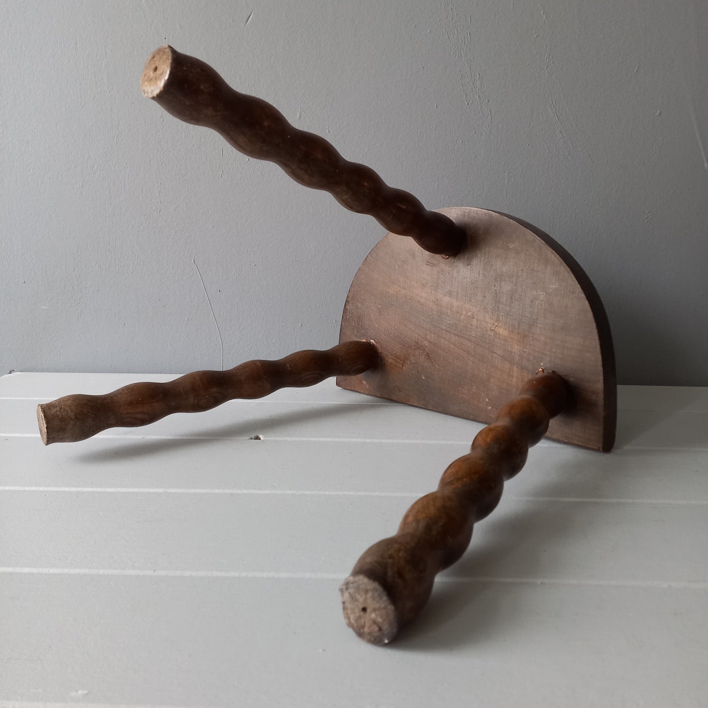 Vintage wooden stool with three turned wooden legs, rustic farmhouse decor, plant stand