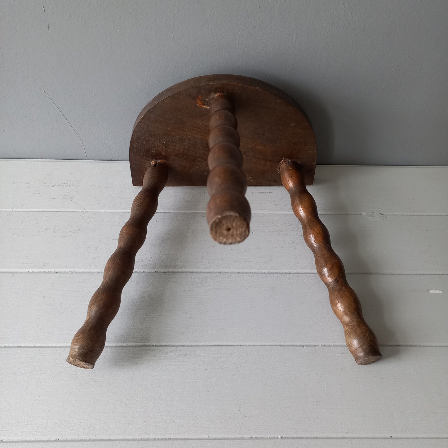 Vintage wooden stool with three turned wooden legs, rustic farmhouse decor, plant stand