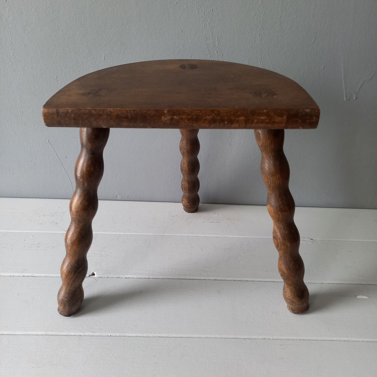 Vintage wooden stool with three turned wooden legs, rustic farmhouse decor, plant stand