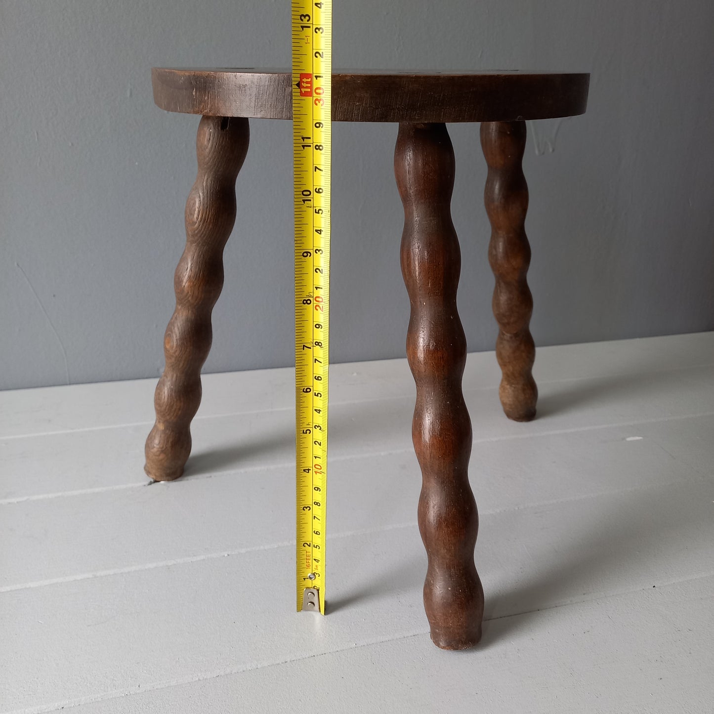 Vintage wooden stool with three turned wooden legs, rustic farmhouse decor, plant stand