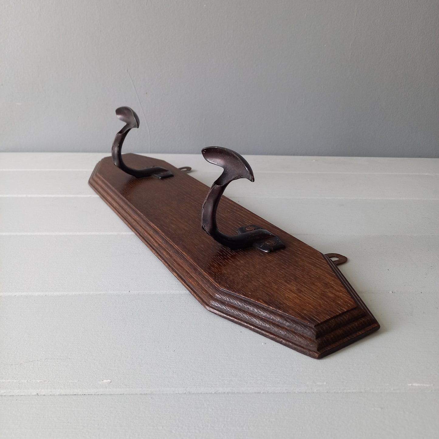 Vintage wooden coat rack with two metal coat hooks