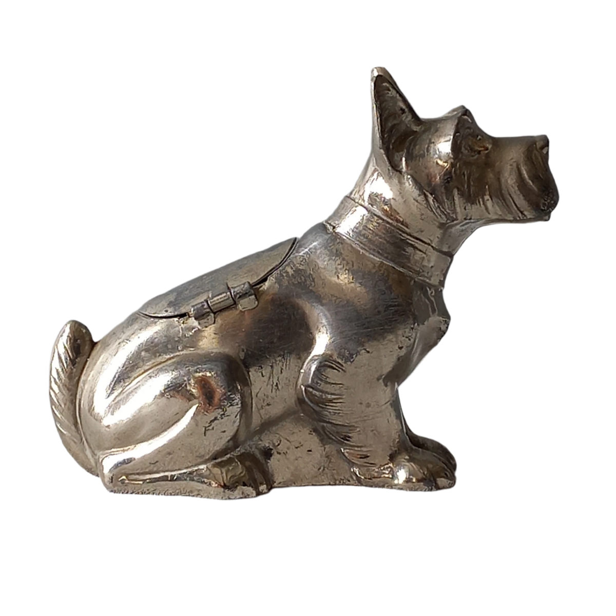 A fabulous French art deco metal terrier dog money box/coin storage box complete with a little padlock and key which still work. 

This unique piece of history was purchased in south west France and we can only imagine who once owned it and what they might have saved their coins to buy.